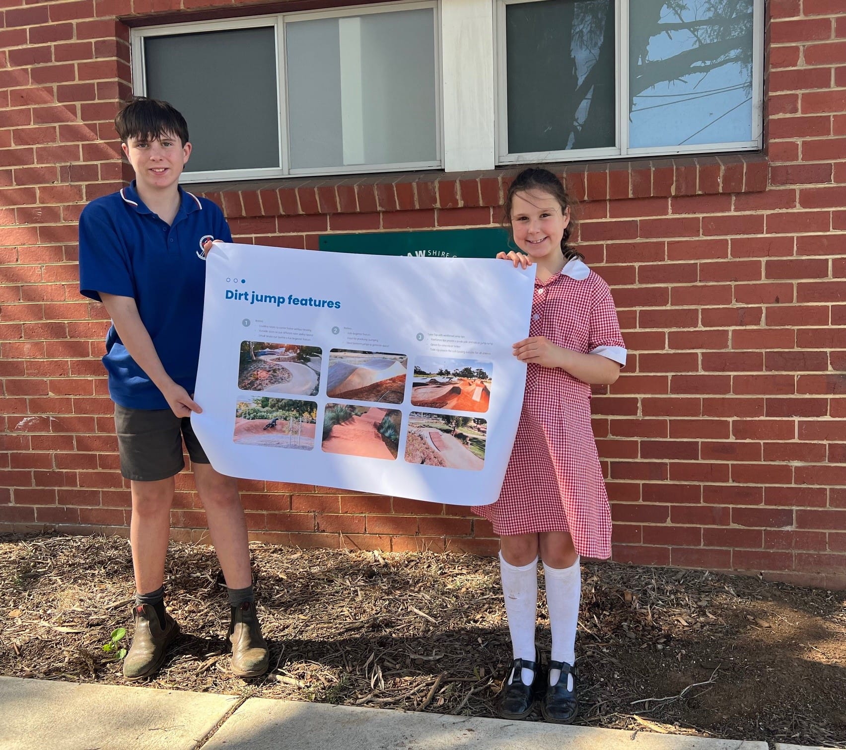 James and Ivy view possible feature designs for a proposed mountain bike track and jumps in Drouin.