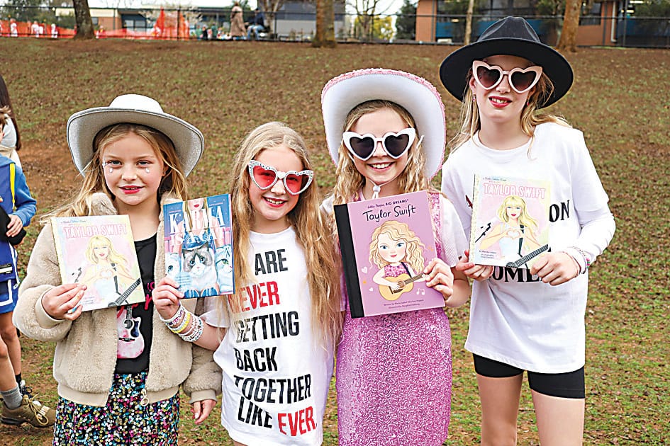 Ruby Elliott, Claire French, Piper Edwards and Georgia Boraston with their favourite Taylor Swift books at the Warragul Campus.