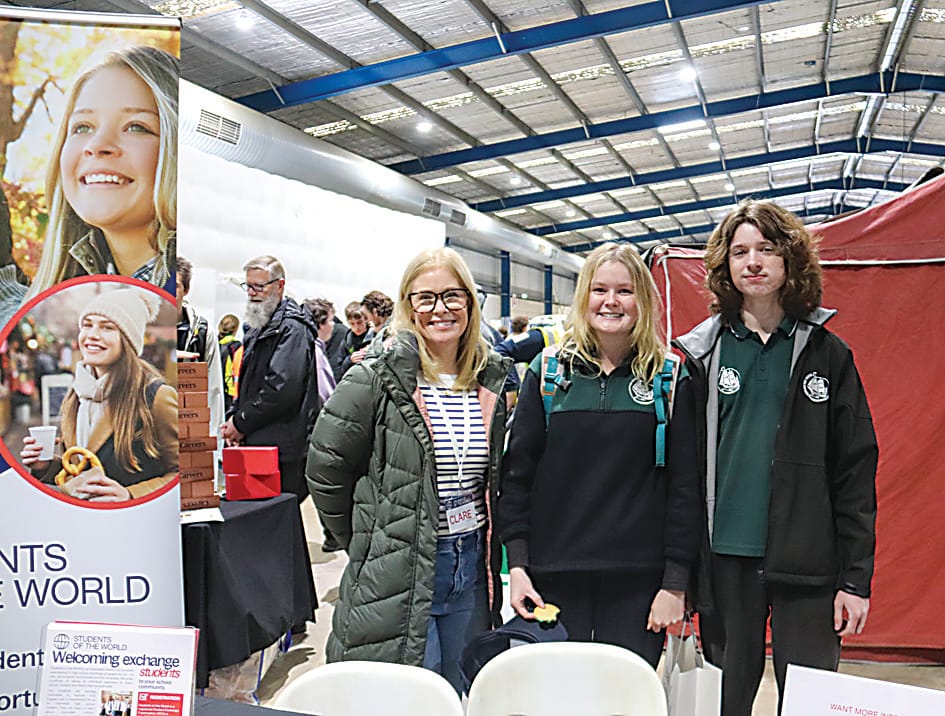 Left: On the Victoria Police stand are (from left) leading senior constable, Paula Fowler, Drouin Secondary College students Aaron Lawrence and Brodie Brindley and leading senior constable Warren Briggs.Right: At the Students of the World Exchange stand are Clare Sacker with Trafalagar High School  studnets Tilly Ott and Alexander Wheatland.