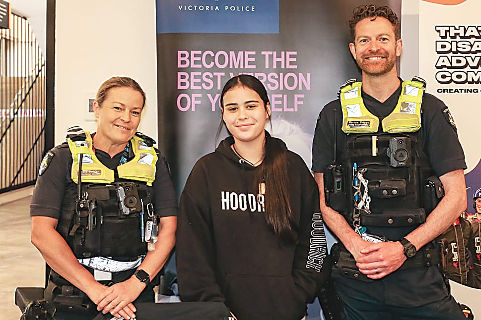 Jasmine MacPherson (centre) discusses a career in policing with leading senior constables Paula Fowler (left) and Warren Briggs (right).