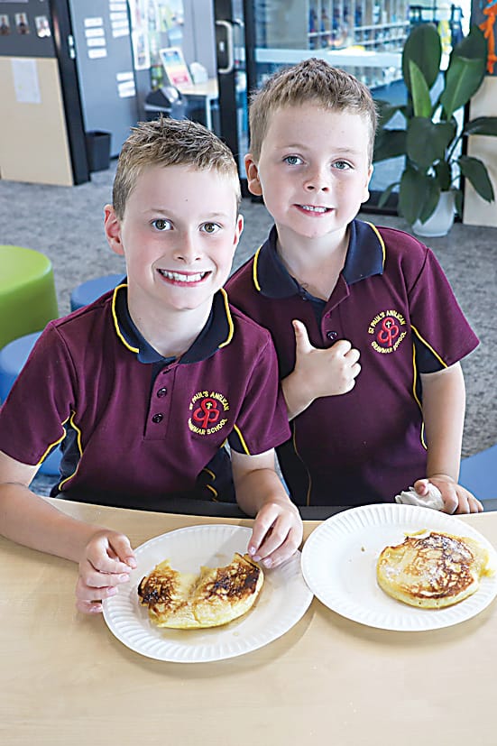 Finn McDonald and Jackson Melrose enjoying their pancakes.