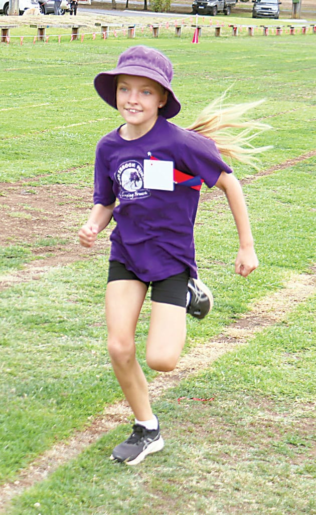 Ripplebrook's Marley Cattanach is all smiles as she approaches the finish line in her race.