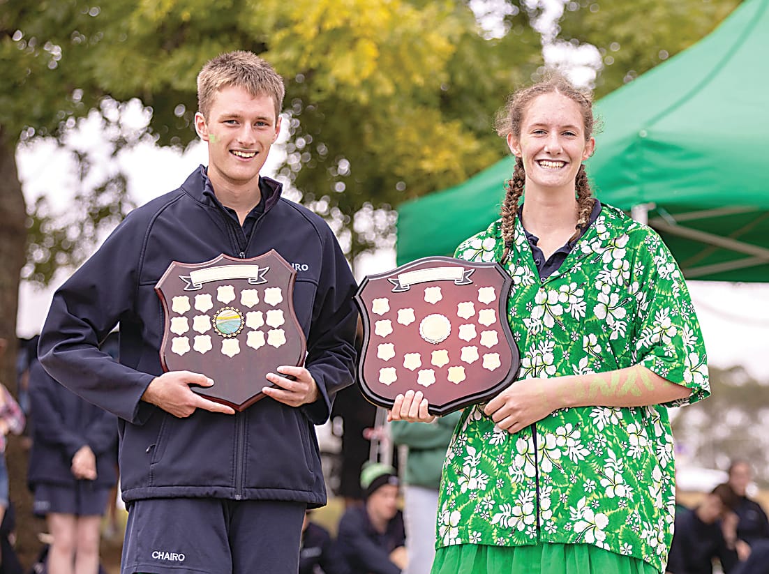 Flynn house captains Lachlan Buchanan and Chloe Johnstone proudly displaying the champion house and house spirit shields.