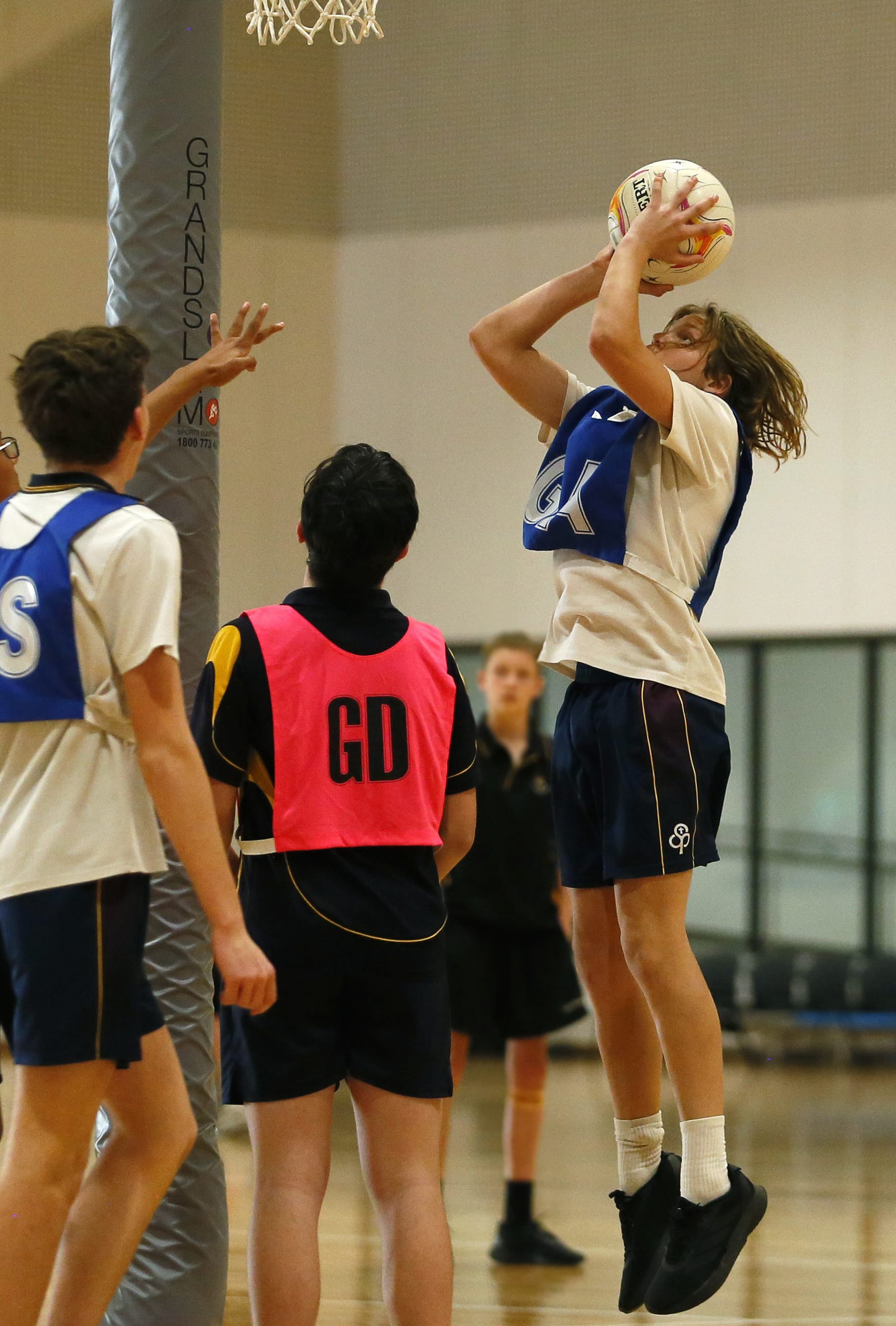Goal attack Ollie Muir shoots at goal.