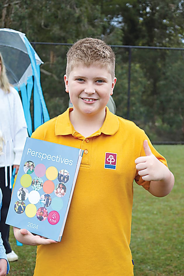 Warragul campus' Zac Wilkinson brought his favourite book, the school magazine and dressed as a student.