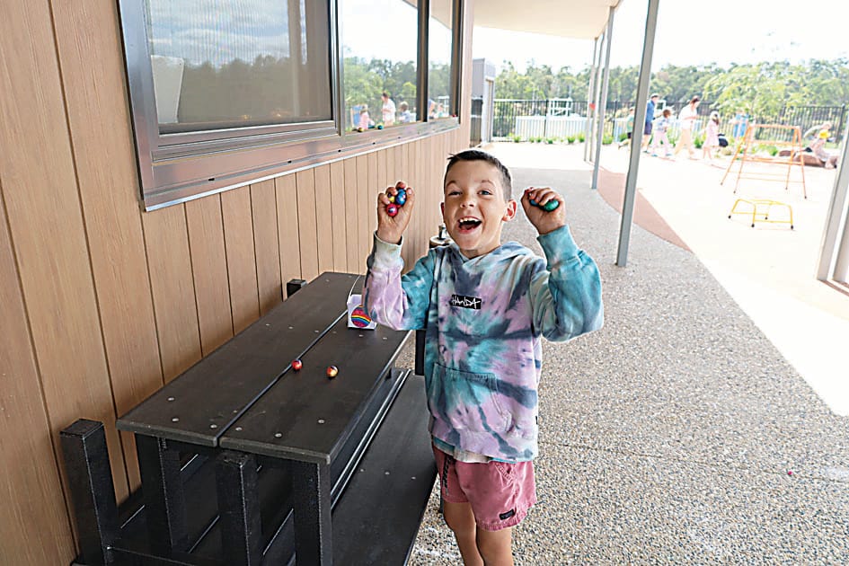 Grade one student Grayson Upston proudly shows all the eggs he found.