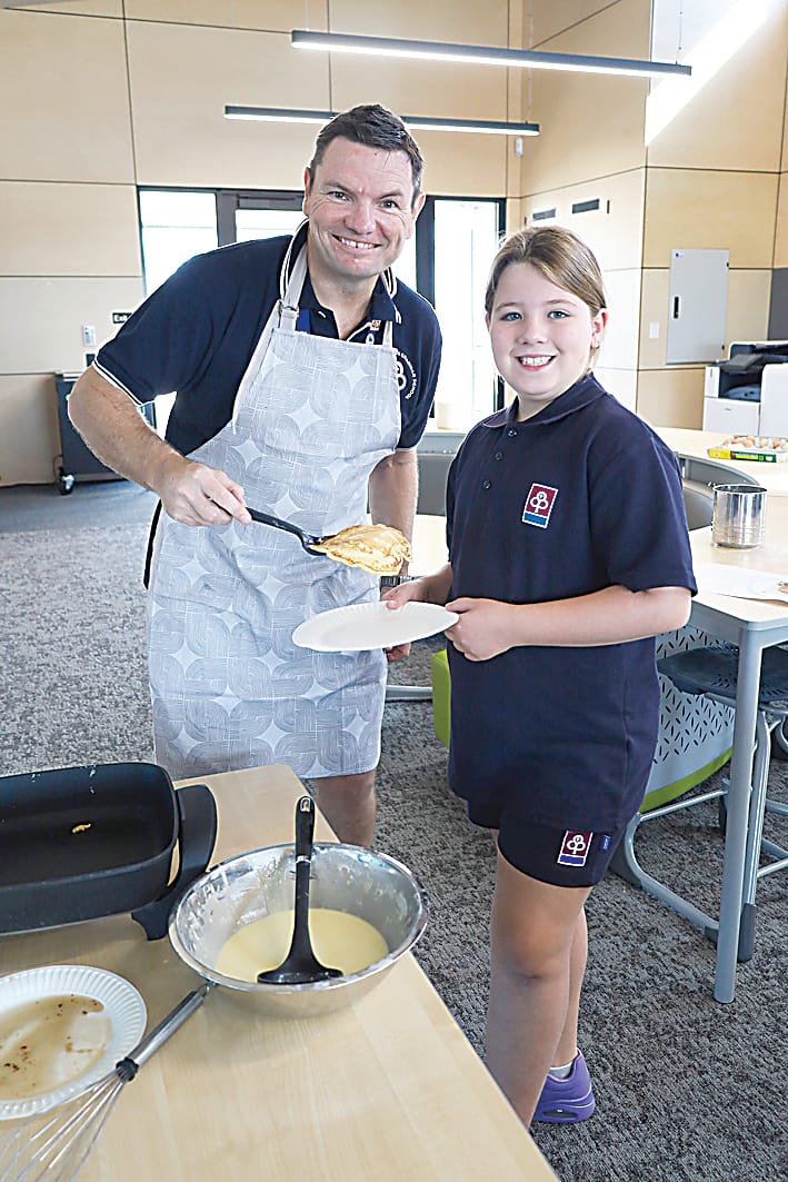 In the spirit of Shrove Tuesday are Blaire Davey and head of Drouin junior school Rowan van Raay.