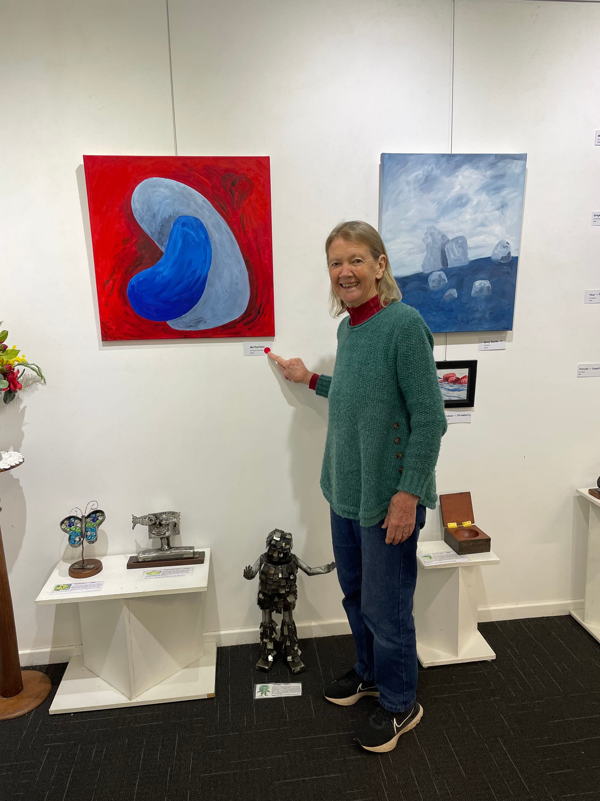 Artist Joan Price with her painting 