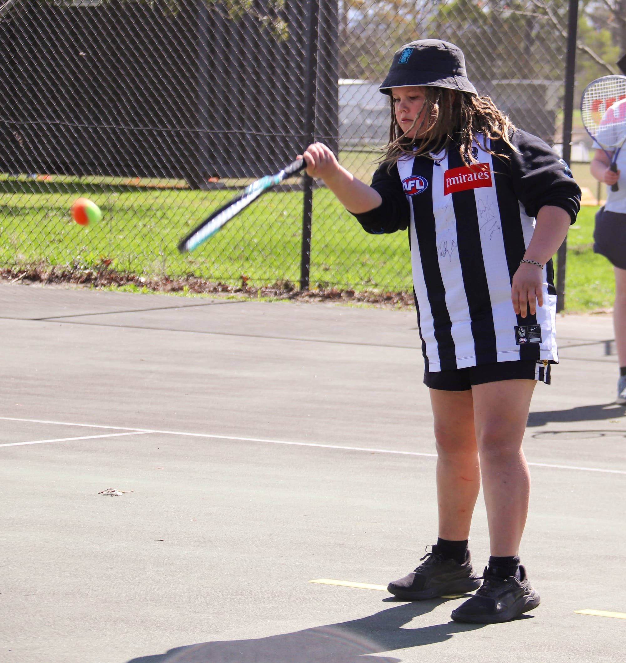 Giving tennis his best shot is Owen Saxton.