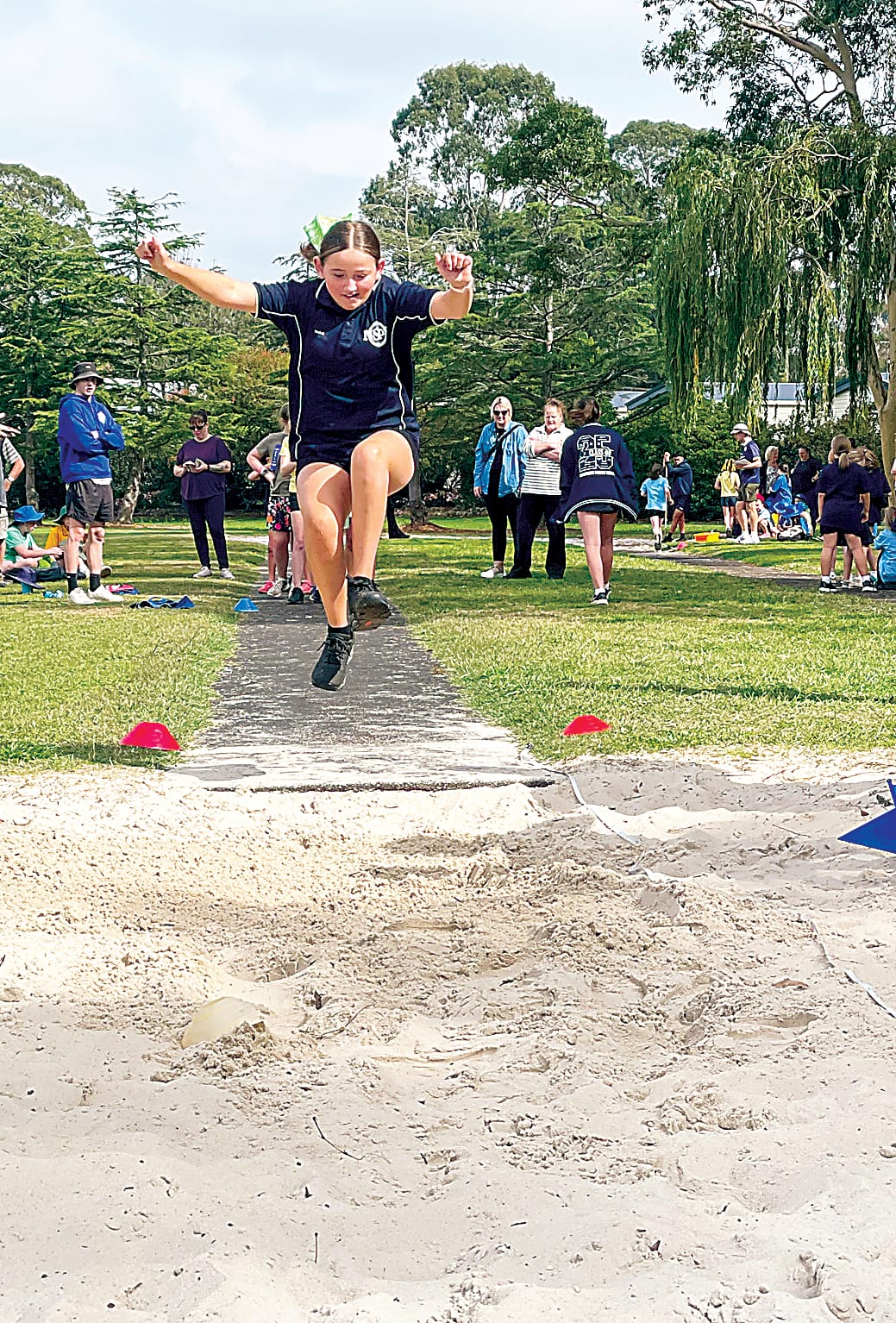 Isabel from Neerim South Primary School soars through the air.