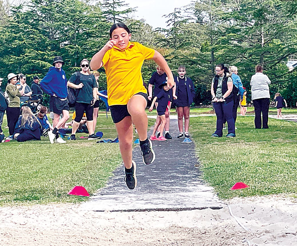 Regan from Jindivick Primary School jumps as high as she can.Photographs by BONNIE COLLINGS. 