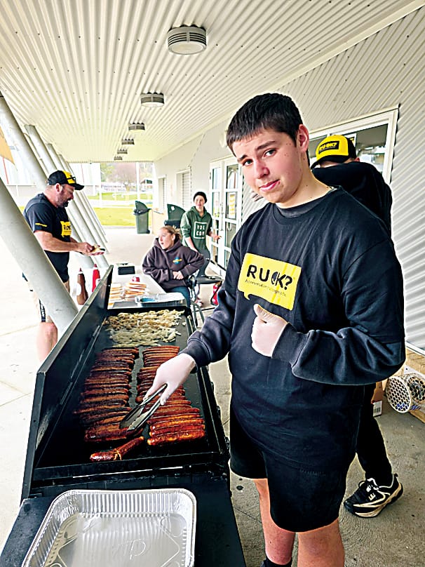 Hunter Timbs cooking up a barbecue to raise awareness for R U OK day on September 11.