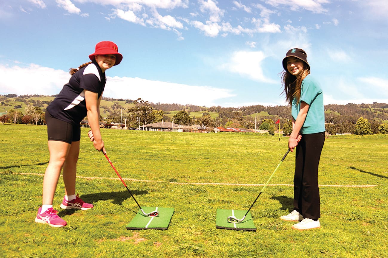 Zoe Malacarne and Holly Faithfull give the golf a go.