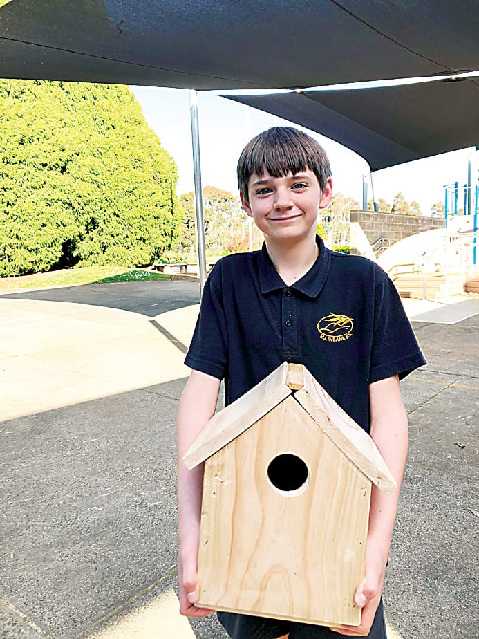 Jack Olsson shows off his bird house.