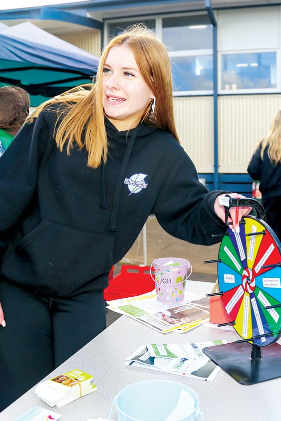 Claudia Anderson spins the wheel.