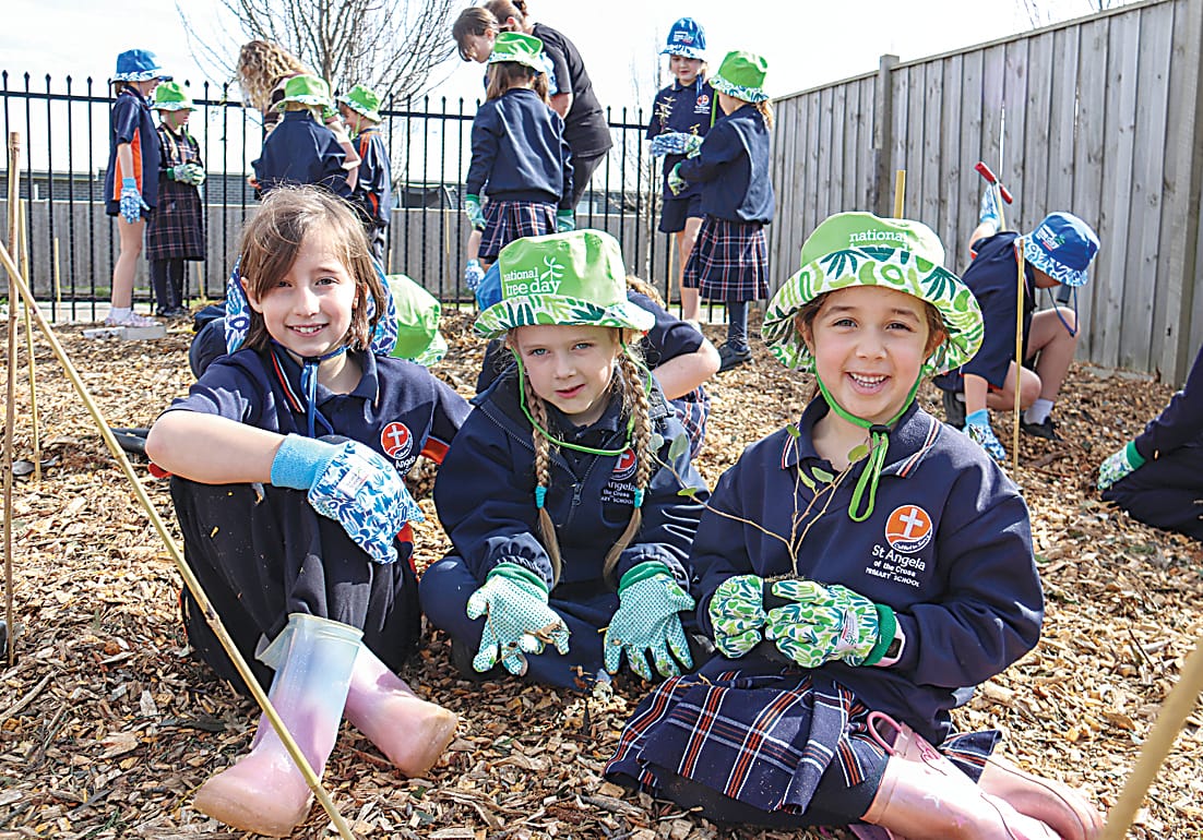 Working together as a team, Molly, Envy and Sienna get their hands dirty to get their new plant in the ground.
