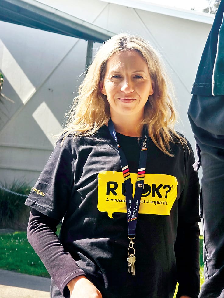 Trafalgar High School's mental health professional Danni Mills supporting the students to prepare their event