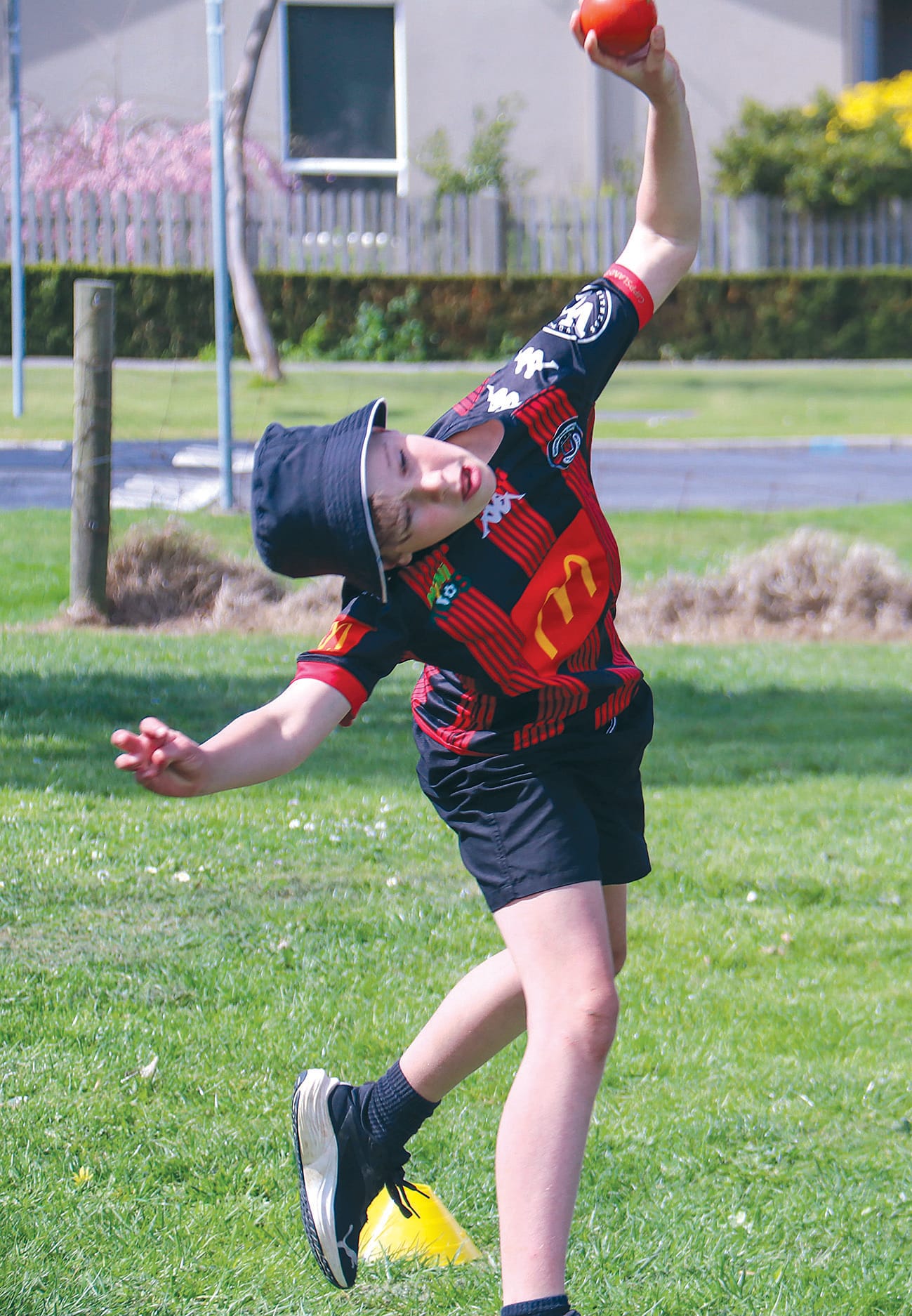 Launching in the shot put is Reuben Saxton.