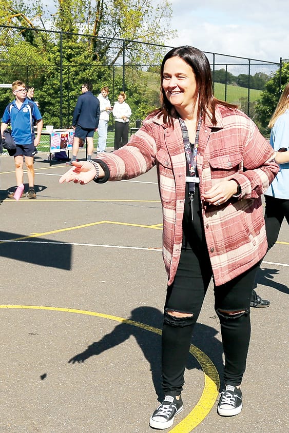 Lisa Jensz attempts a bean bag toss for lollies.