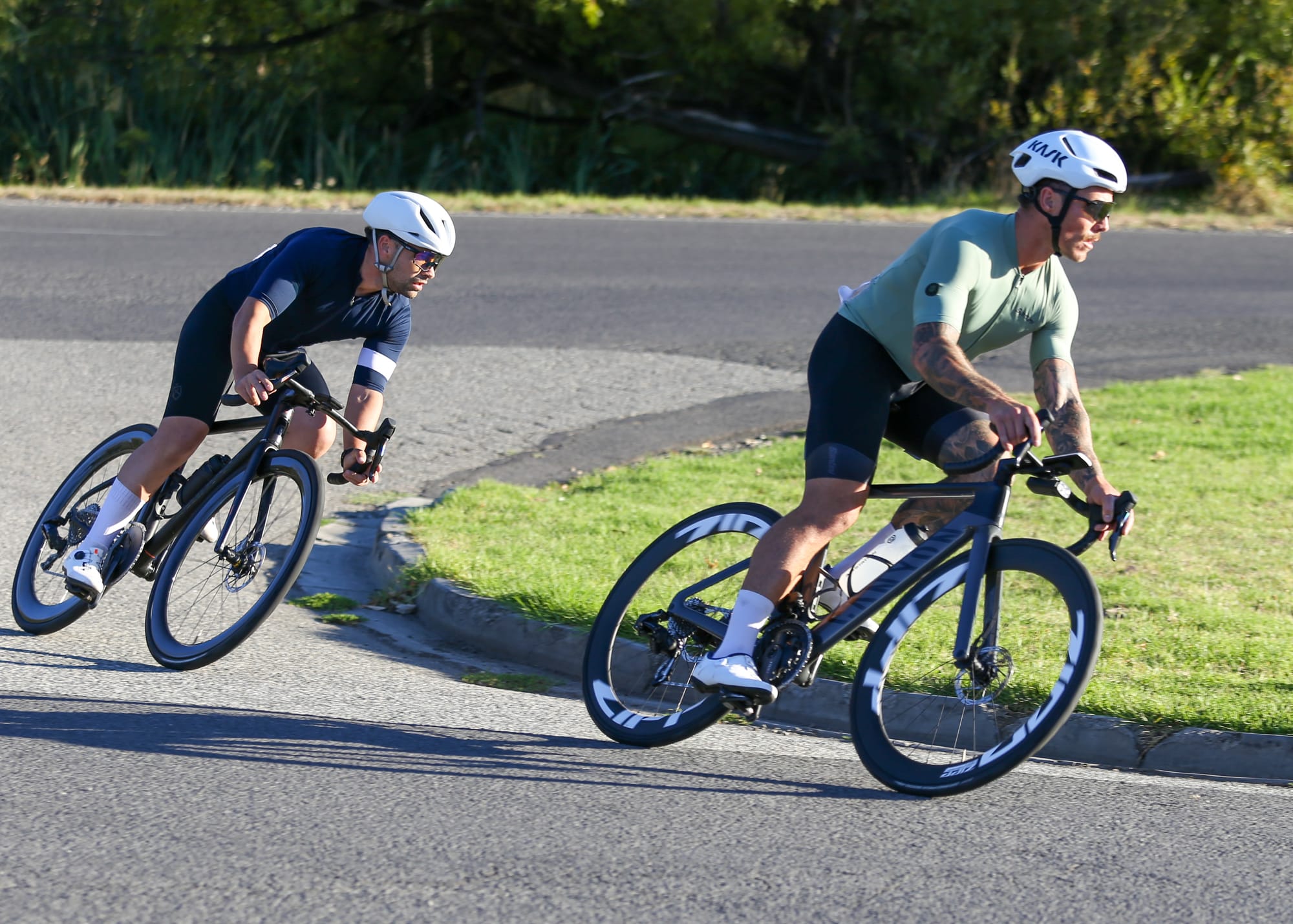 Tom Edwards rounds a corner just ahead of Joel Watson.
