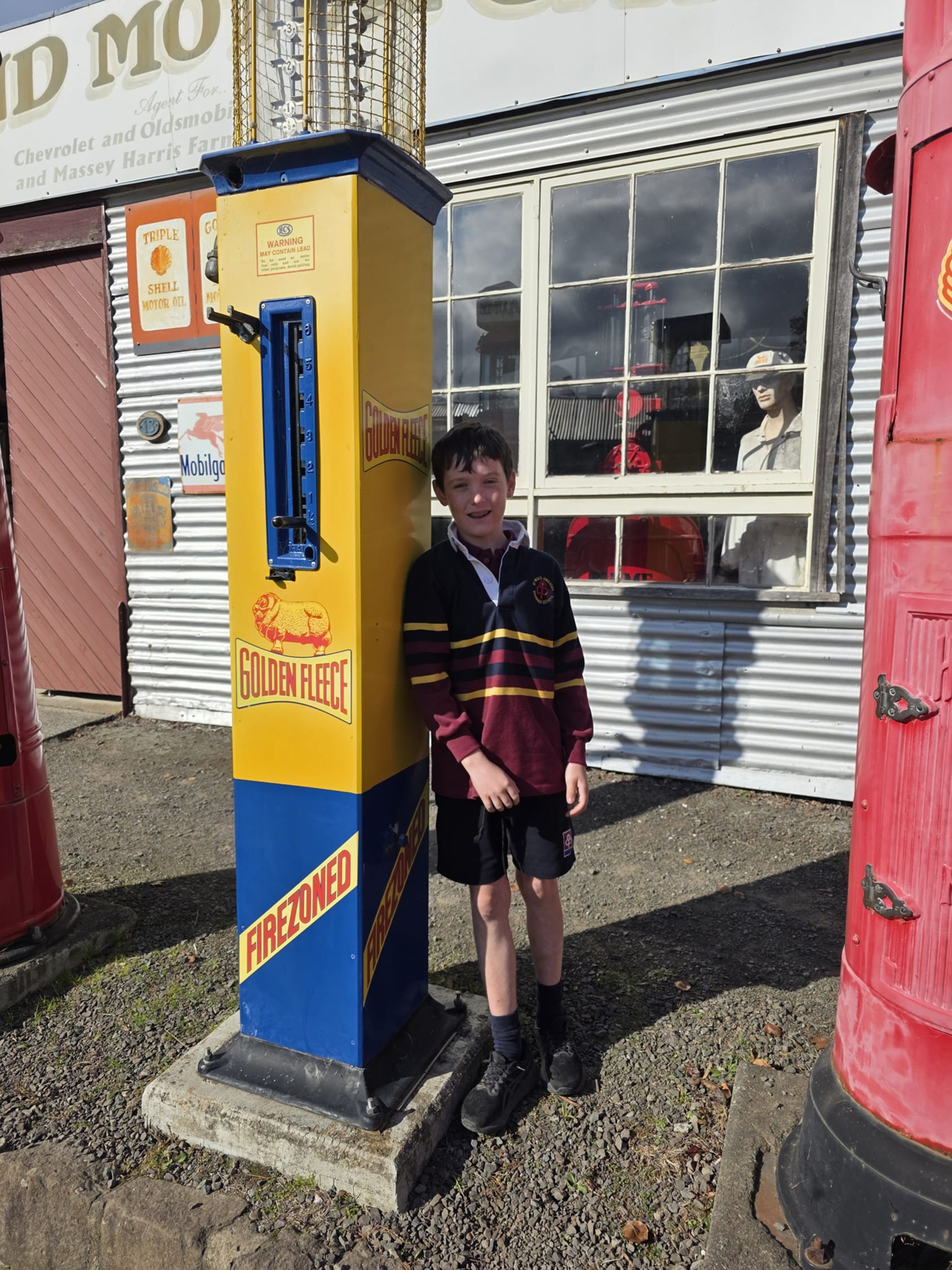 Fynn Upston learns what an old fuel pump looked like.