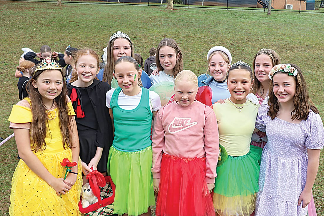 Above: Donning their Book Week character outfits are Warragul campus students Charlotte Sahhar, Maddie Williams, Piper MacDonald, Pia McDonald, Emily Wilson, Emily Williams, Eve Clough, Layla Proctor, Matilda Bentley-Bernard and Mavis Parke.Left: Ruby Elliott, Claire French, Piper Edwards and Georgia Boraston with their favourite Taylor Swift books at the Warragul Campus.