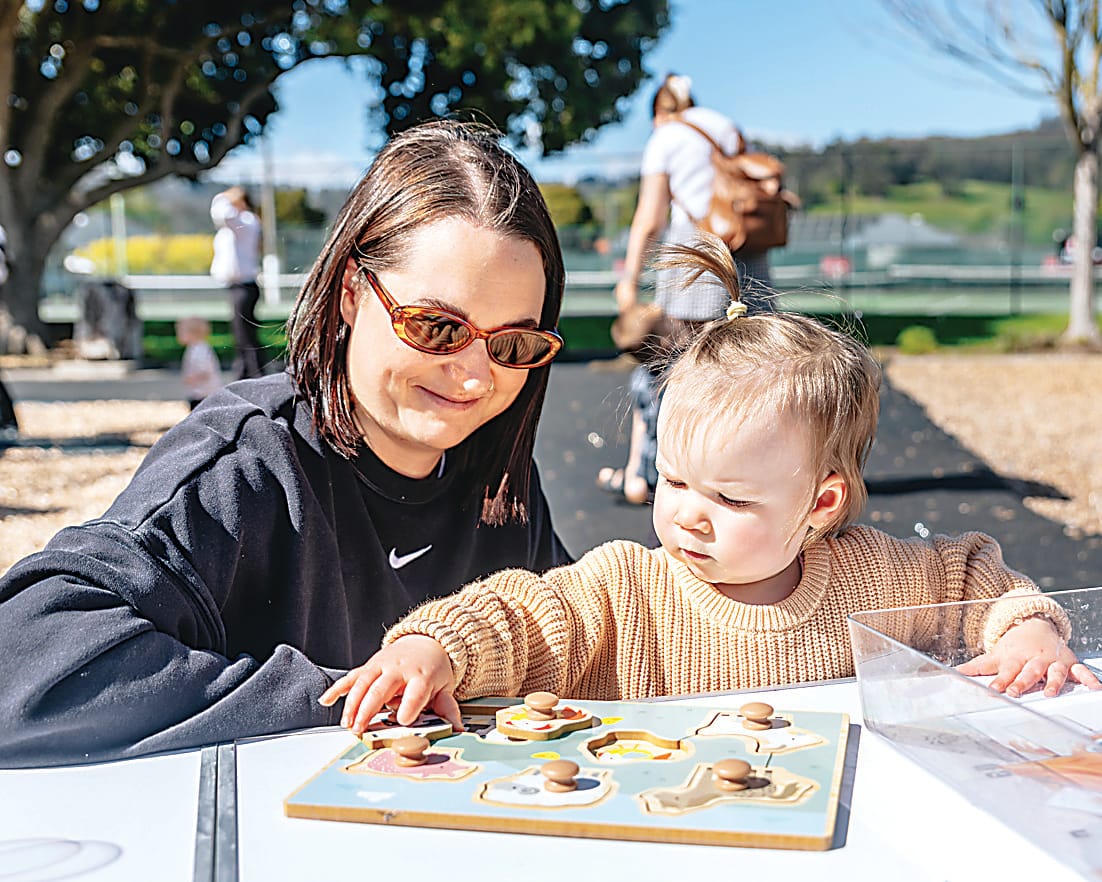 Enjoying the spring sunshine and activities on offer at the Trafalgar pop-up playgroup are Ashton and Isla Dunn.  Photographs: FEARGHUS BROWNE