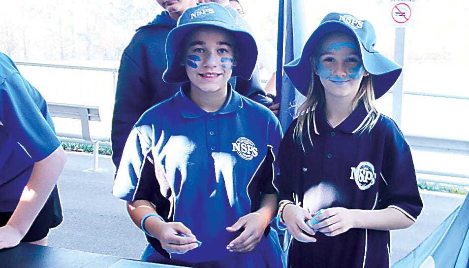 Ella Eddington and Peityn Taylor have blue face paint for Dolly Day.