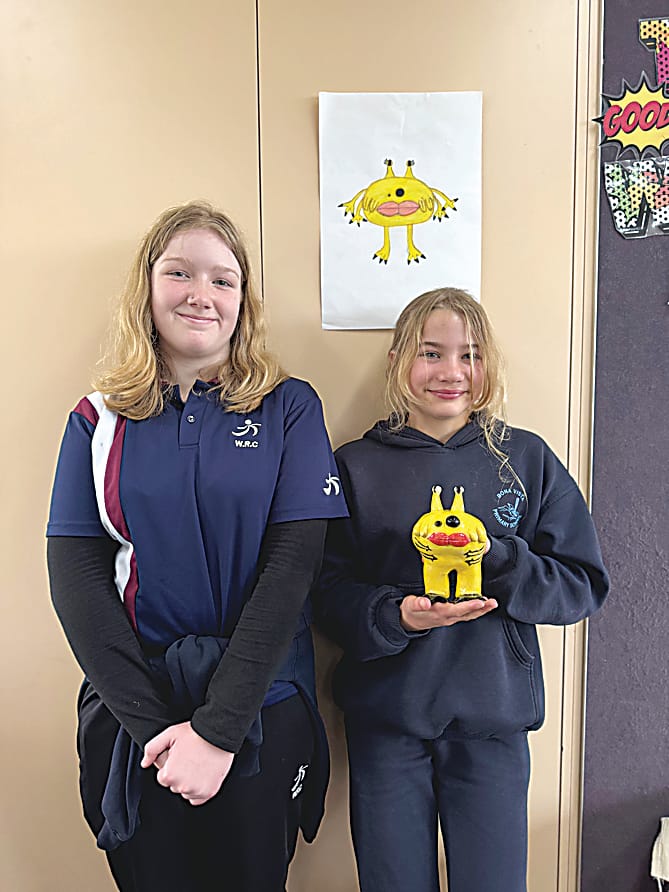 Showing off their joint monster creation are Warragul Regional College year nine student Ashley and Bona Vista grade five student Chane.