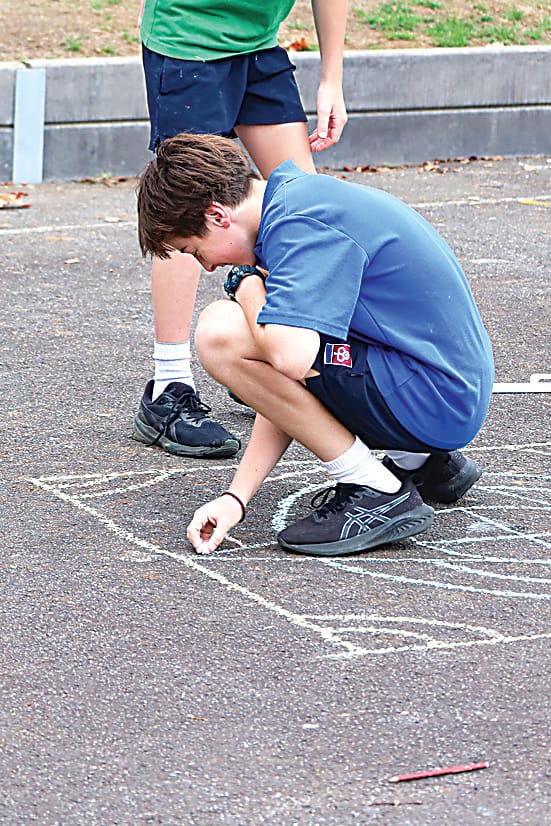 St Paul's student Percy Martel adds a touch of creativity to a mandala.