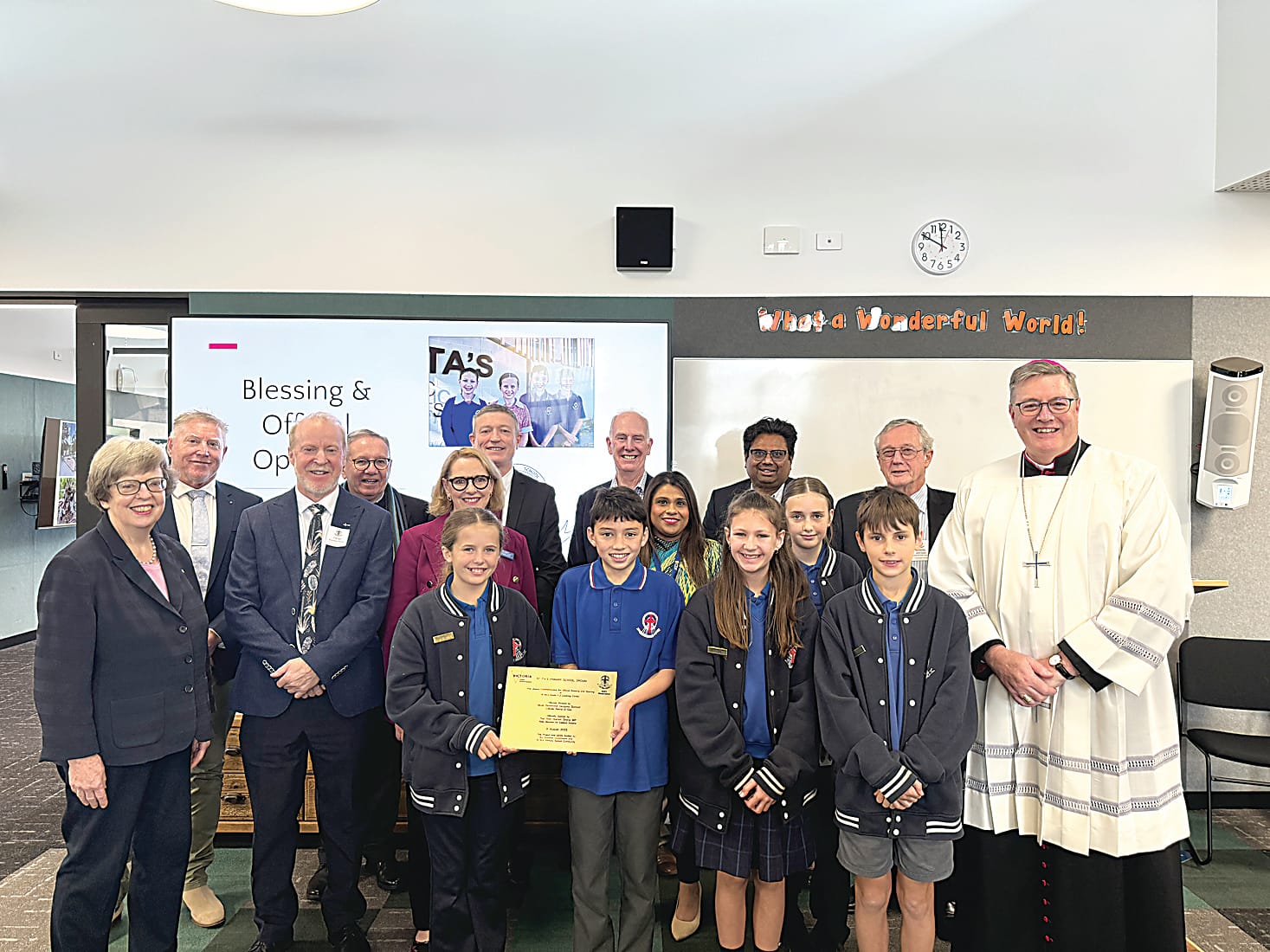 Unveiling the plaque for the stage two redevelopment works at St Ita's Catholic Primary School in Drouin are (back row, from left) principal Andrew Osler, DOSCEL board chair Garry McLean, Diocese of Sale director of Catholic education Paul Velten, DOSCEL board directors Martin Dixon, Dominic Thomas and John Swan, (centre, from left) DOSCEL board director Gabrielle McMullen, Warragul and Drouin Parish priest Fr Brendan Hogan, DOSCEL deputy board chair Cathy Jenkins, Catholic Development Fund relationship manager Tamara Fernandes, student leader Chanelle, Catholic Bishop of Sale Greg Bennet, (front row, from left) and student leaders Ivy, Lou, Tia and Eli.