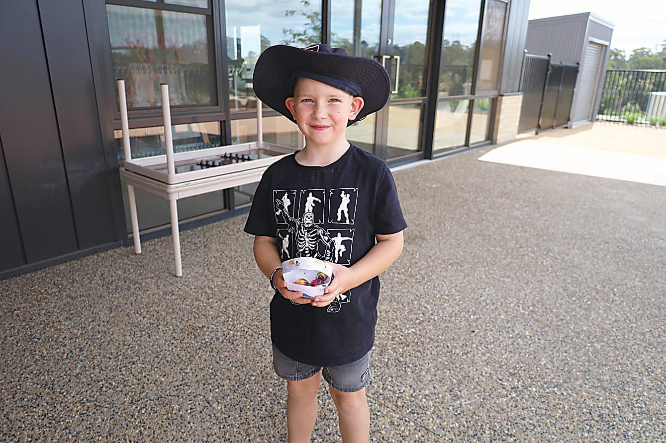 With a basket full of eggs after the Easter egg hunt is grade one student Mack Flint.