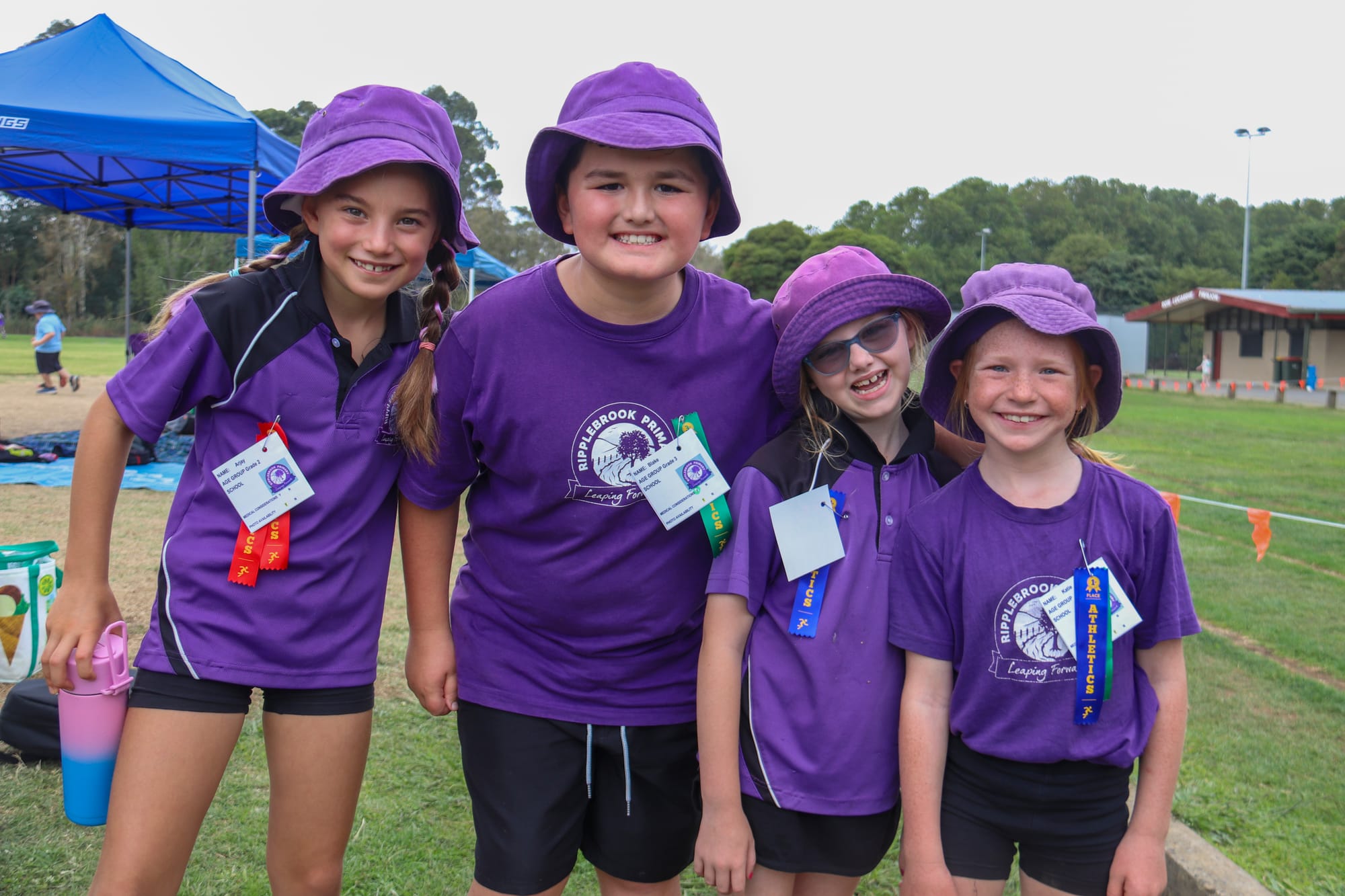 Ripplebrook's Arjay Dunne, Blake Jukes, Marley Coss and Katie Beath cheer on the younger kids during their race.
