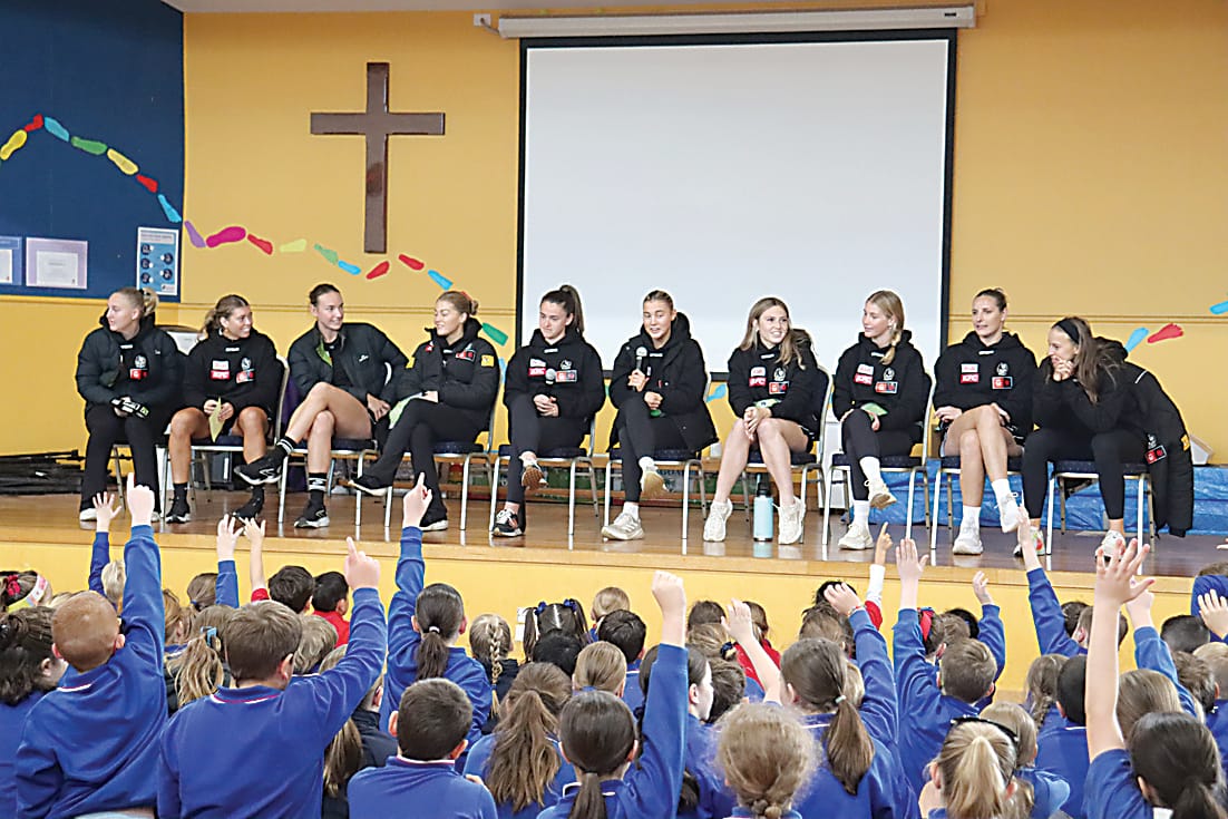 Answering questions at St Ita's Primary School are Collingwood's (from left) Eliza James, Kalinda Howarth, Selena Karlson, Sarah Rowe, Muiranne Atkinson, Amber Schutte, Alana Porter, Violet Patterson, Imogen Barnett and Ruby Schleicher.