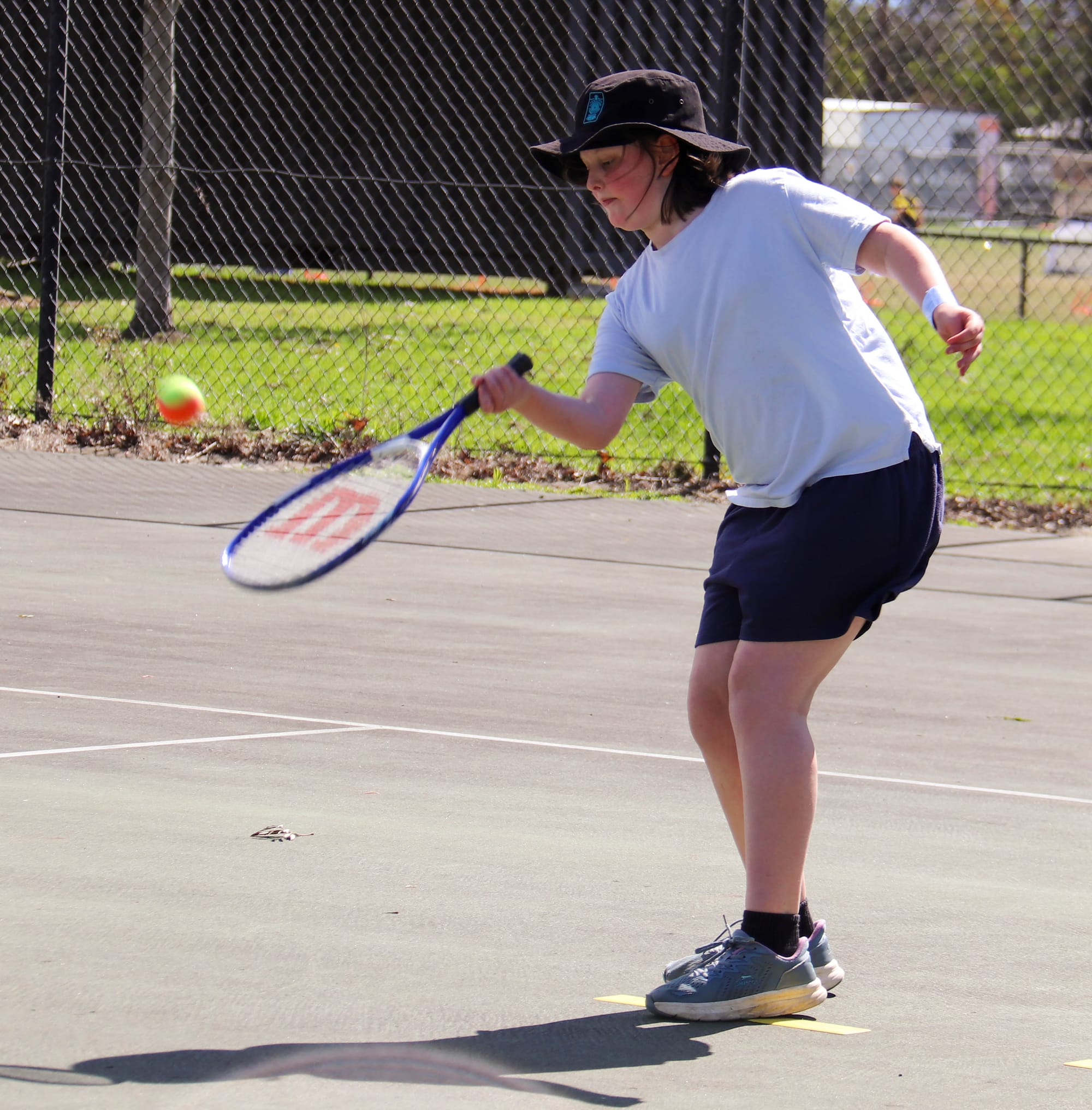 Ruby Landmeter hits a forehand in tennis.