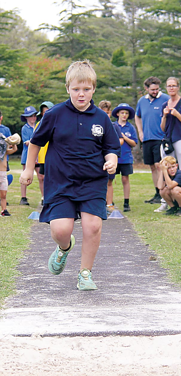 Labertouche Primary School grade three student Pearl lines up her shot put throw.