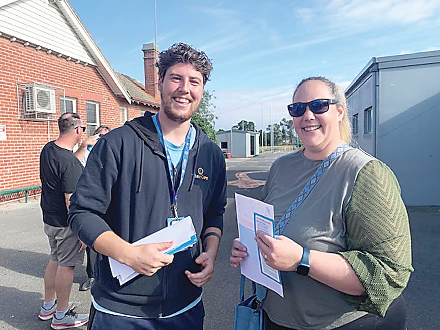 Above: Their Care manager Jett chats with a St Joseph's parent Em.Right: Returning to school was fun for students Olivia (back), Sophie, Conrad and Maya with school crossing supervisor Rosie Sawyer.
