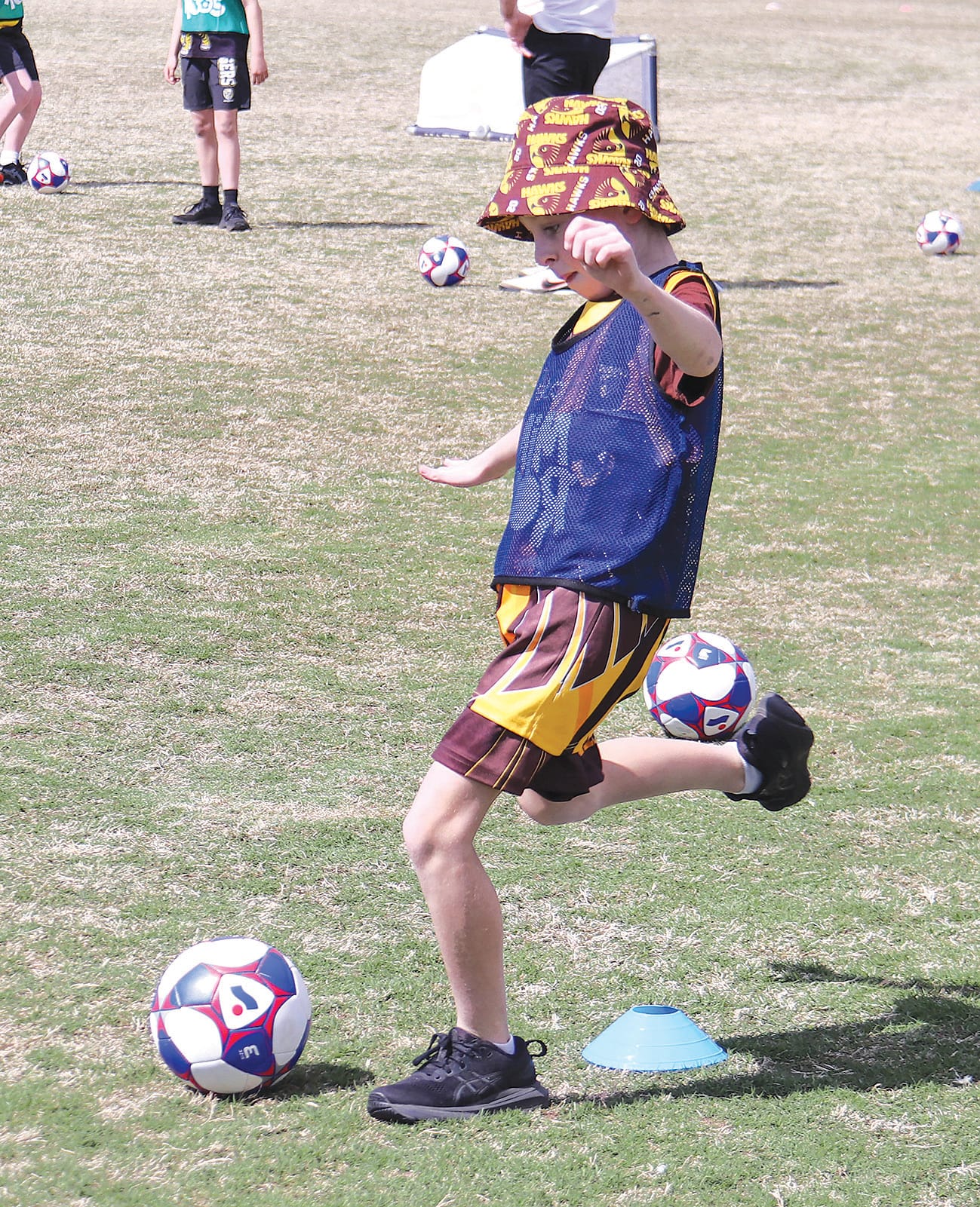 Ashton Drysdale lines up his kick in soccer.