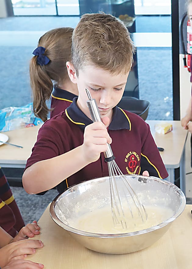 Reef McDonald whips up some pancake batter.