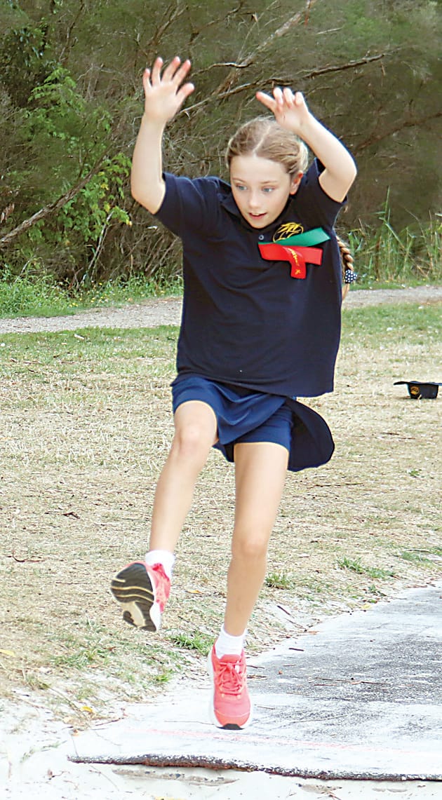 Ellinbank's Yumi Taylor comes in for a landing in long jump.