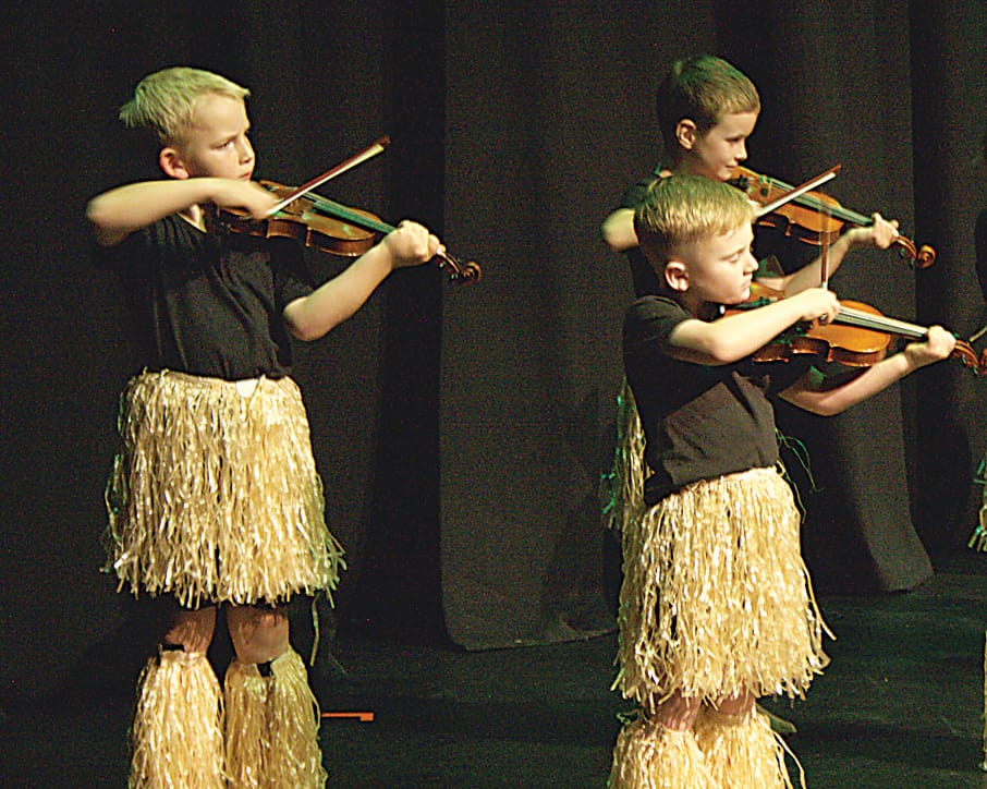 Mack Flint, William Elliott and Finn McDonald performing