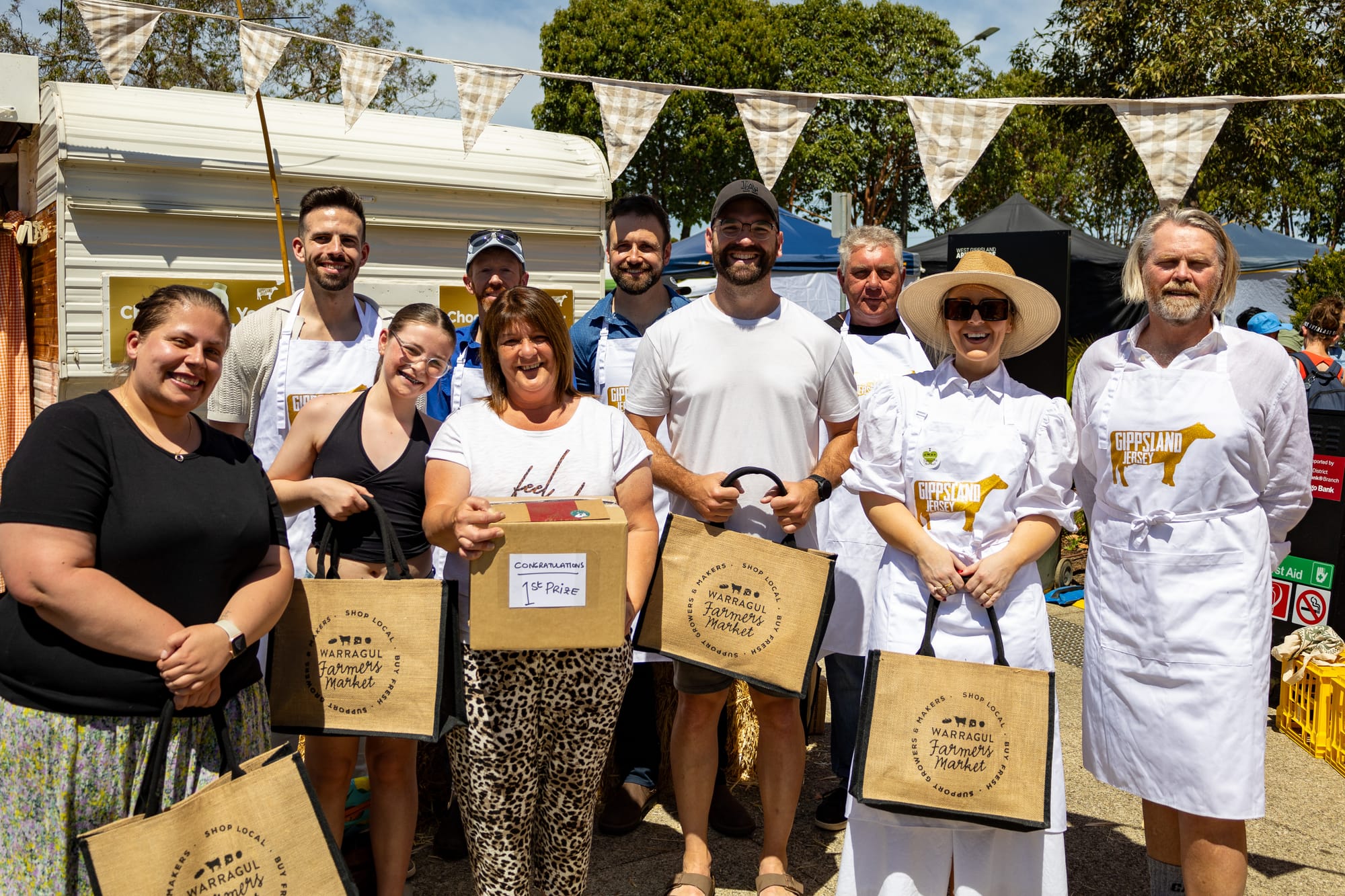 The vanilla slice competition was a hit for judges and winners alike. 
Back (L-R) judges Phil Conway, Luke Wallace, Steve Jones and David Antonie. Front (L-R) second place getter Kirsten Lewis, first place winners Charlee and Tracy Horne, third place getter Isaac Lynn, judge Rebecca Little and head judge Baking Association of Australia president Andrew O'Hara. Photo courtesy of Grant McKillop Photography.