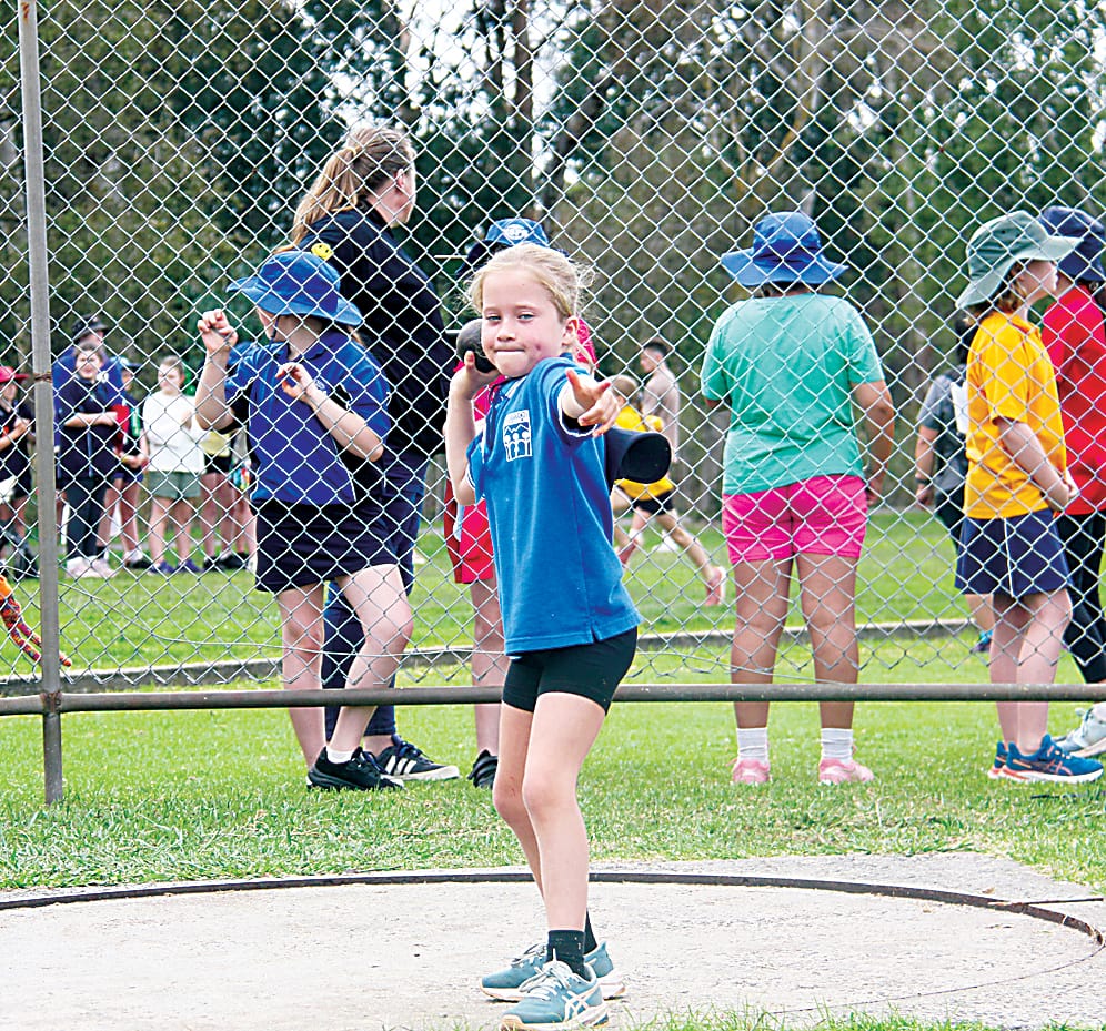 Labertouche Primary School grade three student Pearl lines up her shot put throw.