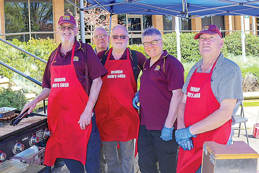 Cooking up a sausage sizzle at the expo are members of the Drouin Men's Shed, Dennis Auld, Michael Garvey, Chris Green, Steve Bone and Peter Broughan.