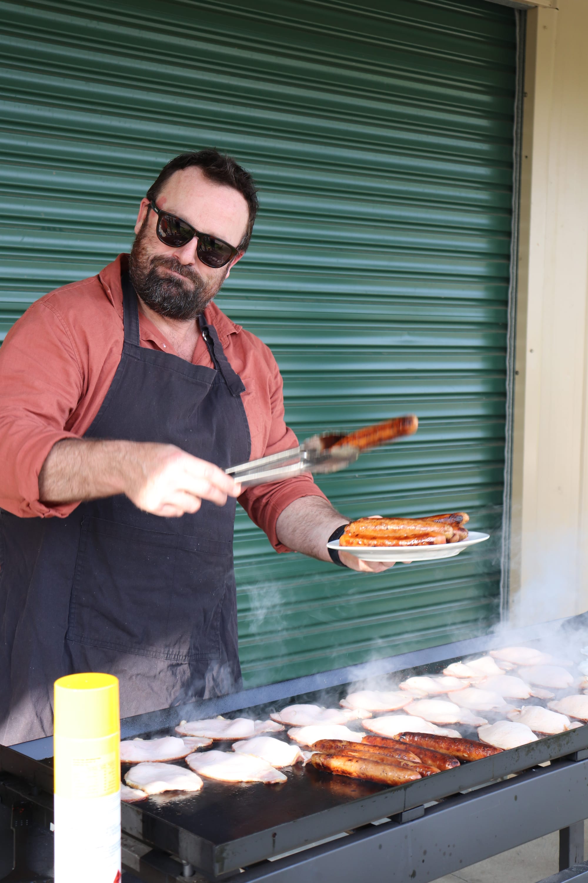 Principal Brett Pedlow cooks breakfast for the year 12 students on their final day.