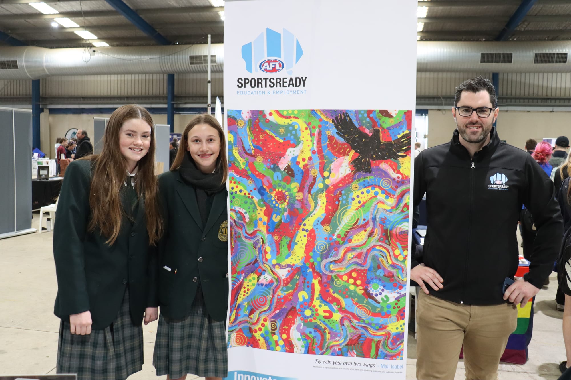 Marist Sion students Milena Gleeson and Molly McNamara with Grant Wilson from AFL Sportsready.