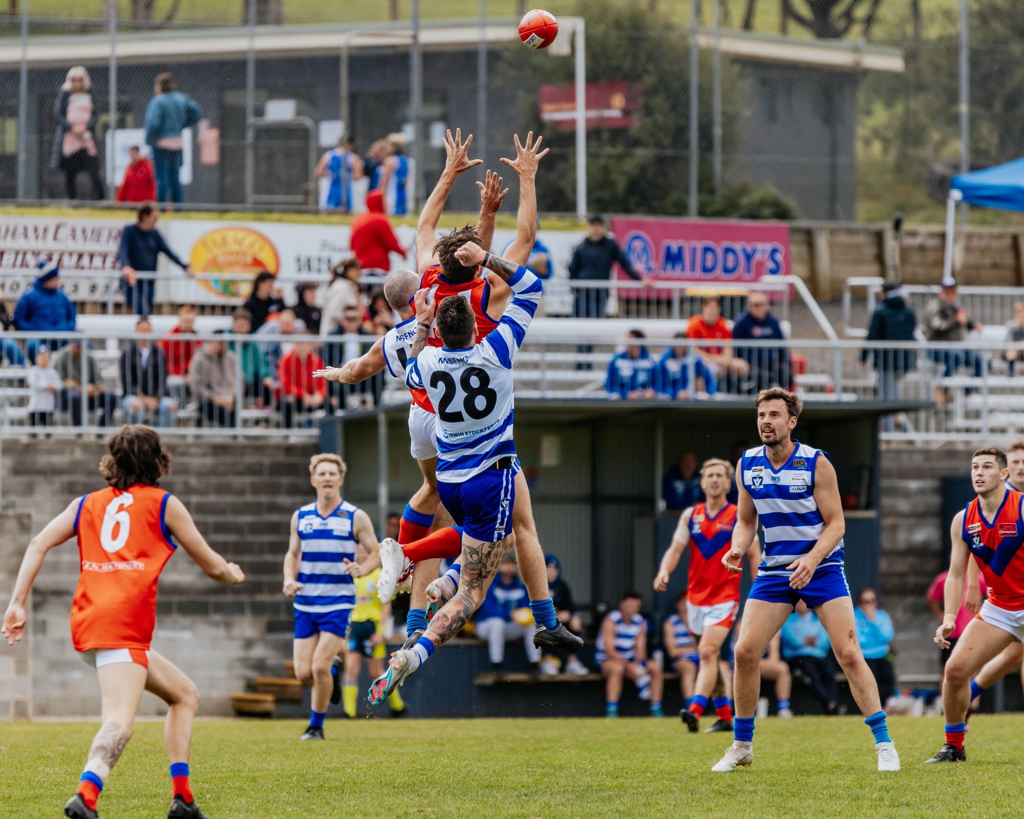 Rivals clash in front of AFL stars