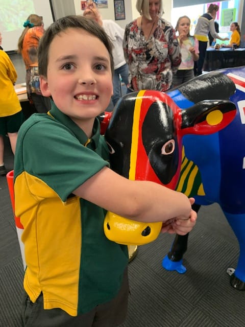 Grade two student Darcy Yeomans looking after the cow.