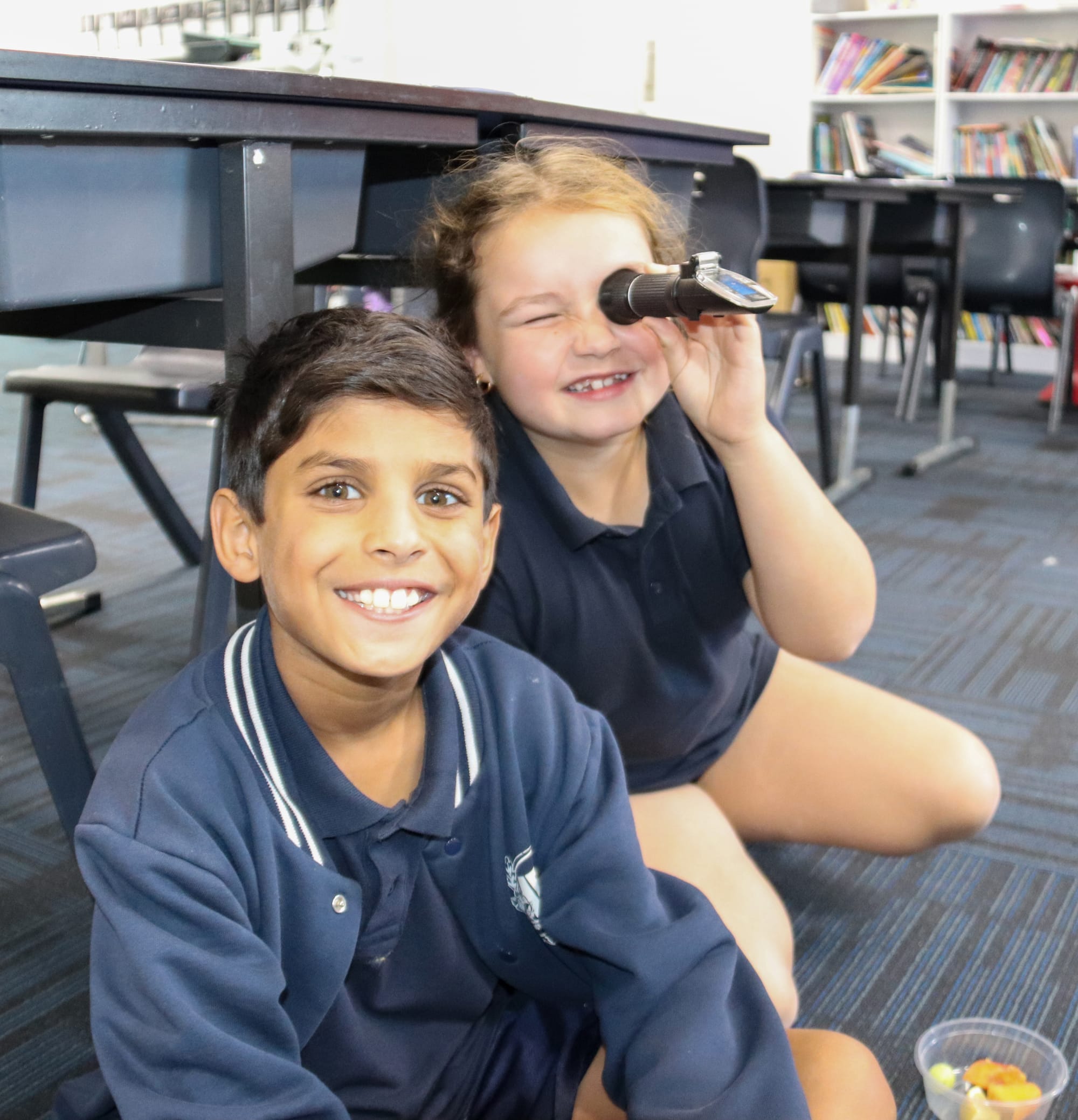 Hayden and Emilia enjoy getting the chance to learn about different fruits and how they're grown.