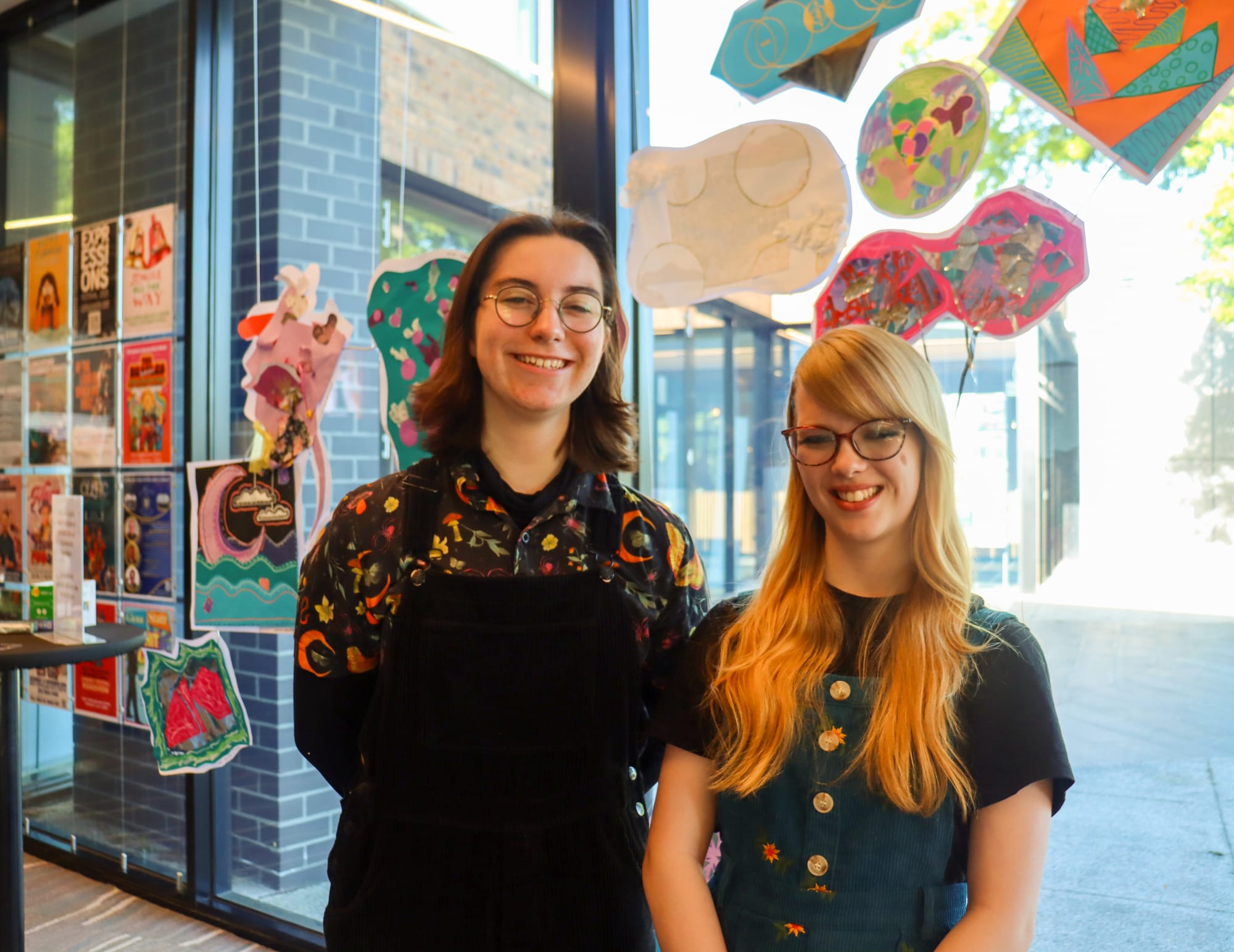 Young producer George Pergl-Tormai and performer Inara Wilhelms pose under the 